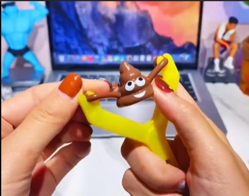 Elastic Poop Emoji Slingshot Toy - Image 3