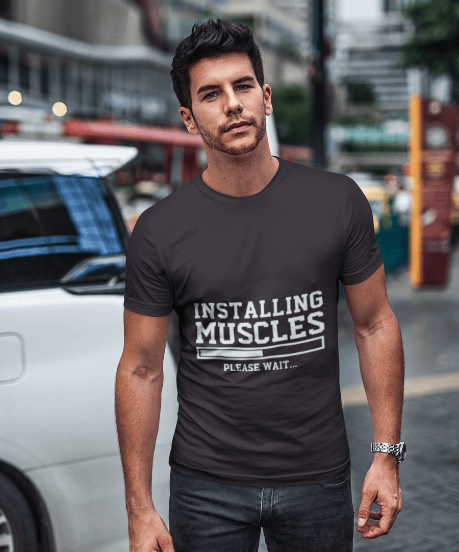 Installing Muscles Funny T-shirt - Image 0