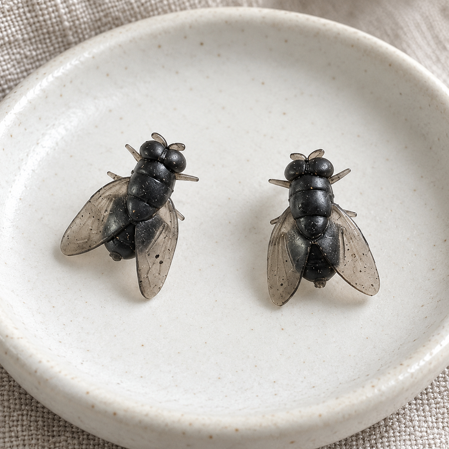 Pair of Buzzkill resin fly stud earrings with translucent wings