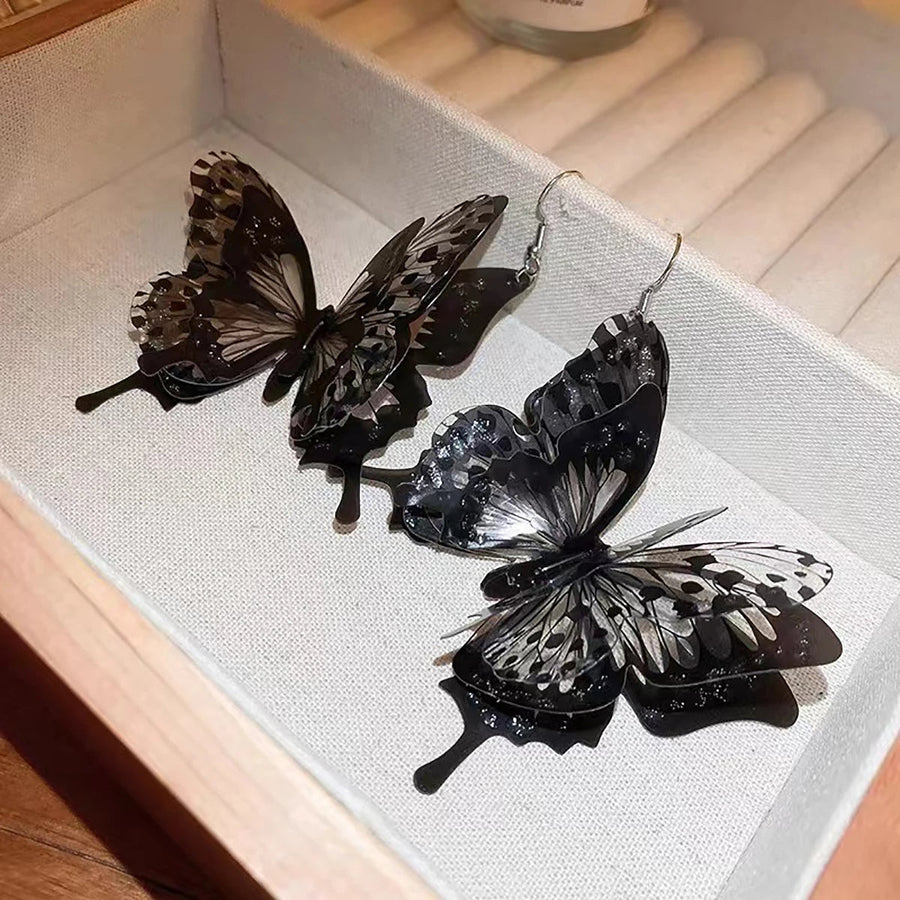 Black Hollow Butterfly Dangle Earrings - Image 2