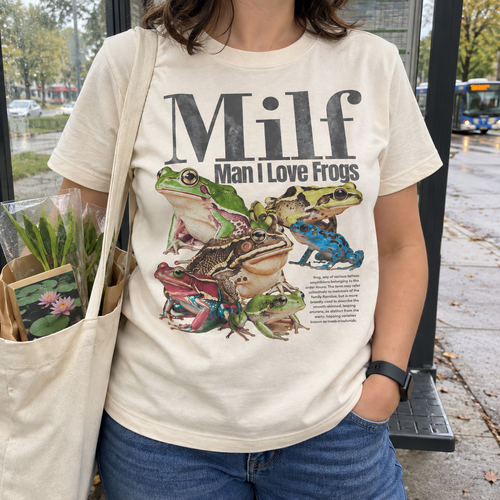 Cream frog graphic T-shirt worn casually outdoors